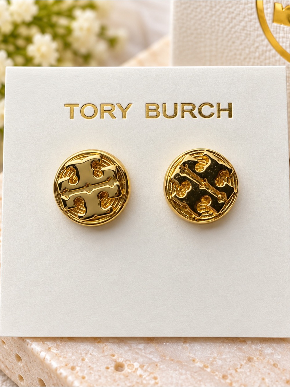 Earrings on Tory Burch card